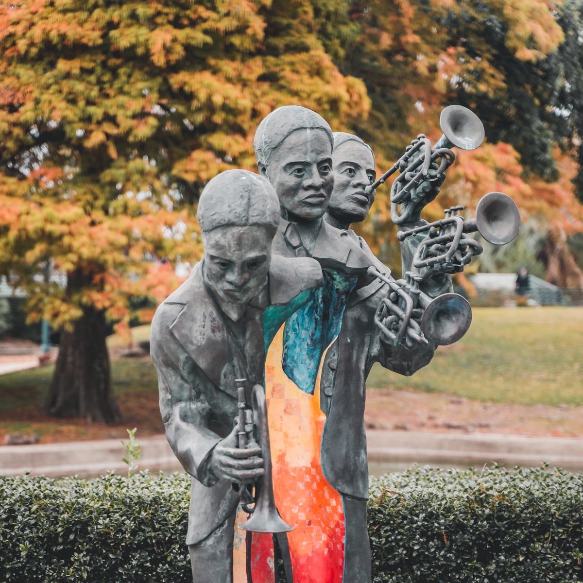 man in orange shirt statue